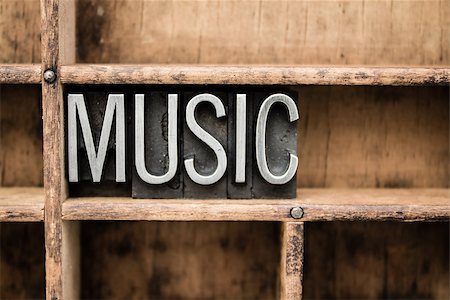 simsearch:400-04570412,k - The word "MUSIC" written in vintage metal letterpress type in a wooden drawer with dividers. Stock Photo - Budget Royalty-Free & Subscription, Code: 400-07984141