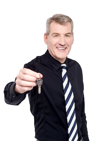 Real estate agent offering new house key Stock Photo - Budget Royalty-Free & Subscription, Code: 400-07984799