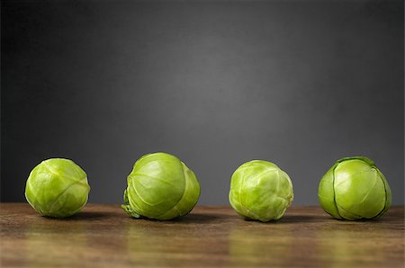 simsearch:400-05370250,k - Four brussels sprouts on raw on wooden table Stock Photo - Budget Royalty-Free & Subscription, Code: 400-07986709