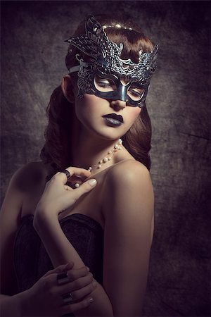 picture theater mask - Gorgeous, mysterious female in carnival, silver mask, with brown long hair and dark make up wearing black dress. Stock Photo - Budget Royalty-Free & Subscription, Code: 400-07981243