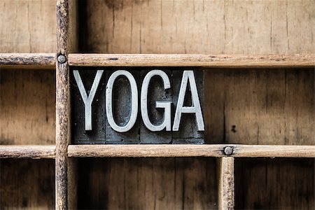 The word "YOGA" written in vintage metal letterpress type sitting in a wooden drawer. Stock Photo - Budget Royalty-Free & Subscription, Code: 400-07983320