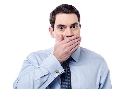Shocked man covering mouth with hand Stock Photo - Budget Royalty-Free & Subscription, Code: 400-07983841