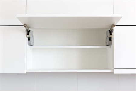 opened white kitchen cabinet with empty shelf Stock Photo - Budget Royalty-Free & Subscription, Code: 400-07983992