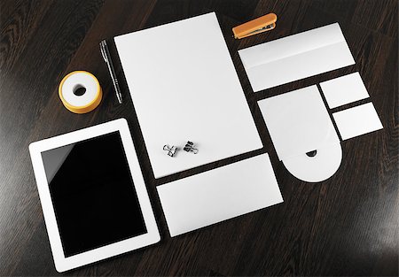 Blank stationery and corporate identity template on dark wooden background.  For design presentations and portfolios. Stock Photo - Budget Royalty-Free & Subscription, Code: 400-08016575