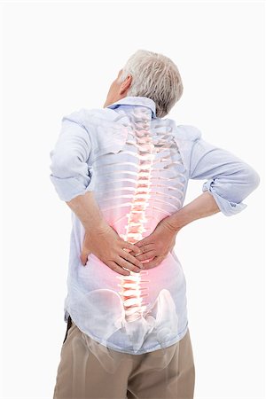 Digital composite of Highlighted spine of man with back pain Stock Photo - Budget Royalty-Free & Subscription, Code: 400-08017405