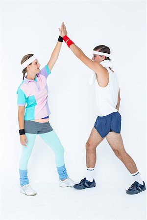 Geeky hipster couple in sportswear on white background Stock Photo - Budget Royalty-Free & Subscription, Code: 400-08017729