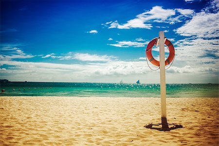 saver - Lifebuoy on the beach, a tropical coastline Stock Photo - Budget Royalty-Free & Subscription, Code: 400-08011143