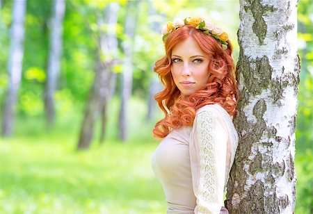 Portrait of attractive woman with red hair in the park, wearing gentle flowers wreath and stylish dress, fashion and vogue concept Stock Photo - Budget Royalty-Free & Subscription, Code: 400-08021416