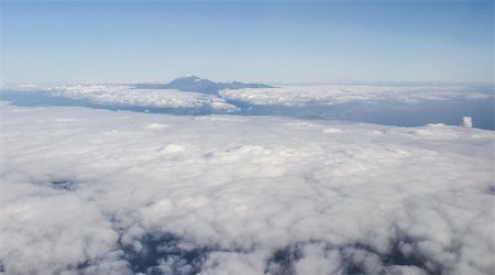 planes flying above the clouds - Volcano Teide, aerial view from window of airplane. Canary Island, Spain Stock Photo - Budget Royalty-Free & Subscription, Code: 400-08034658