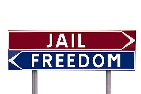 simsearch:400-05730469,k - Direction Signs with choice between Jail or Freedom isolated on white background Stock Photo - Budget Royalty-Free & Subscription, Code: 400-08033812