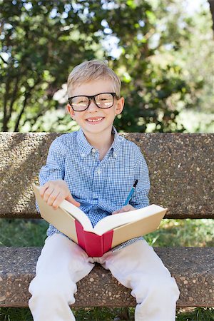 simsearch:695-03381153,k - smiling little schoolboy in glasses holding book ready to go to school, back to school concept Stock Photo - Budget Royalty-Free & Subscription, Code: 400-08047831