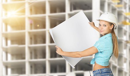 Woman in hard hat holding blank drawing sheet in front of building under construction, looking, at camera, smiling Stock Photo - Budget Royalty-Free & Subscription, Code: 400-08040346