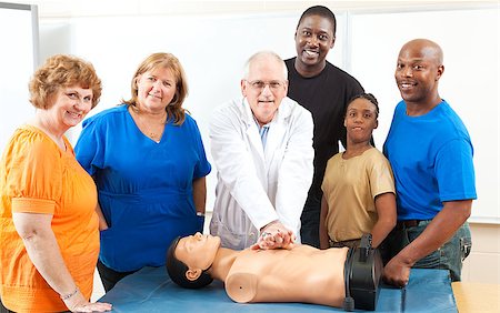 simsearch:400-07411030,k - Adult education class learning CPR first aid from a doctor. Stock Photo - Budget Royalty-Free & Subscription, Code: 400-08040628