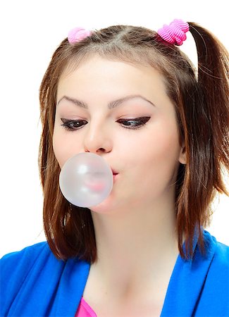 Beautiful young lady blowing big bubble gum on white background Stock Photo - Budget Royalty-Free & Subscription, Code: 400-08042050
