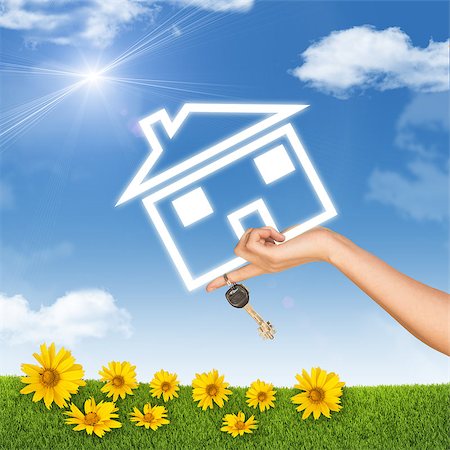 finger holding a key - Hand holding house icon and key. Background of blue sky, clouds and sun, sunflower, green grass Stock Photo - Budget Royalty-Free & Subscription, Code: 400-08043026