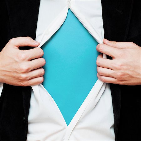 super - Businessman showing a copy space under his shirt like superhero, tearing his shirt off Stock Photo - Budget Royalty-Free & Subscription, Code: 400-08051369