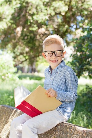 simsearch:695-03381153,k - smiling little boy in glasses studying, back to school concept Stock Photo - Budget Royalty-Free & Subscription, Code: 400-08053090