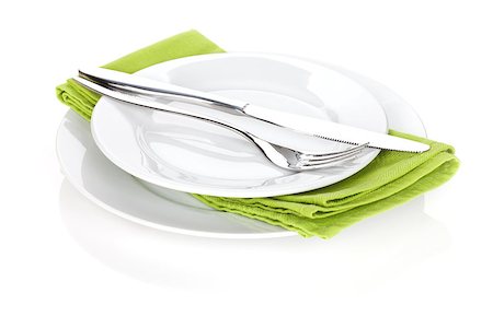 simsearch:400-06076985,k - Silverware or flatware set of fork and knife over plates. Isolated on white background Stock Photo - Budget Royalty-Free & Subscription, Code: 400-08074288