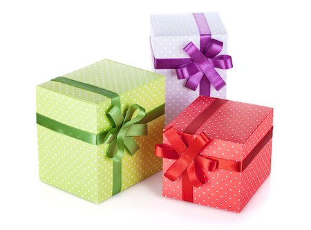 simsearch:400-08806797,k - Three colorful gift boxes with ribbon and bow. Isolated on white background Photographie de stock - Aubaine LD & Abonnement, Code: 400-08074283