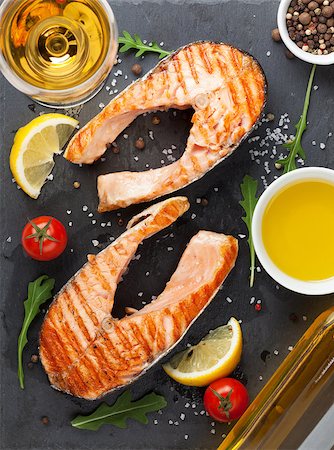 Grilled salmon and white wine on stone board. Top view Stock Photo - Budget Royalty-Free & Subscription, Code: 400-08075429