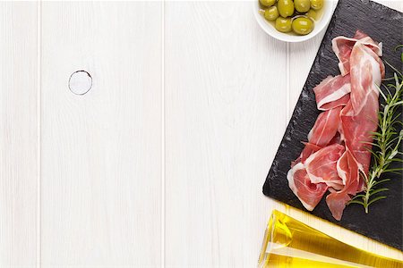 simsearch:400-06207145,k - Prosciutto with rosemary and olive oil on wooden table. Top view with copy space Stock Photo - Budget Royalty-Free & Subscription, Code: 400-08078017