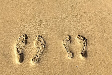 Two pairs footsteps on the coral sandy beach Stock Photo - Budget Royalty-Free & Subscription, Code: 400-08070721