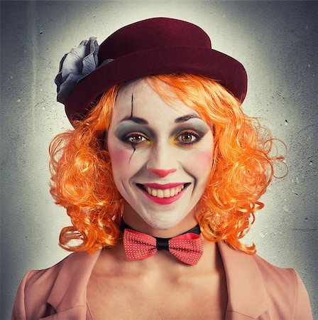 Beautiful vintage woman clown smiling and extravagant Stock Photo - Budget Royalty-Free & Subscription, Code: 400-08072429