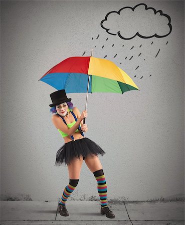 Clowns with rainbow umbrella sheltering from rain Stock Photo - Budget Royalty-Free & Subscription, Code: 400-08073681