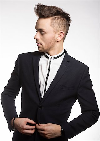 fashion young model male , wearing a trendy black suit , with white shirt he is looking on one side Stock Photo - Budget Royalty-Free & Subscription, Code: 400-08098250