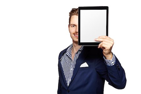 face to internet technology - Portrait of a cheerful young businessman holding a blank digital tablet. Photographie de stock - Aubaine LD & Abonnement, Code: 400-08093635