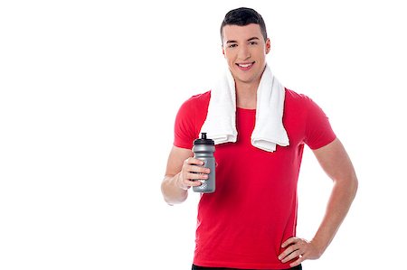 simsearch:400-06482604,k - Fitness guy holding sipper, towel around his neck Stock Photo - Budget Royalty-Free & Subscription, Code: 400-08108174