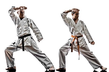 student fighting - two karate men sensei and teenager student teacher teaching isolated on white background Stock Photo - Budget Royalty-Free & Subscription, Code: 400-08111049