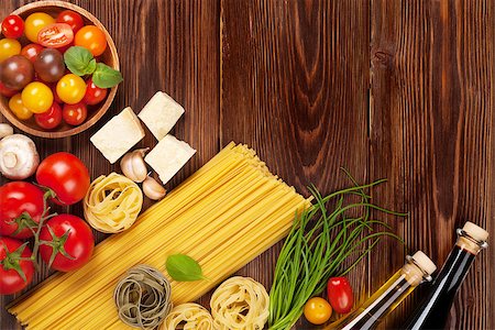 simsearch:400-06796273,k - Italian food cooking ingredients. Pasta, tomatoes, basil. Top view with copy space Stock Photo - Budget Royalty-Free & Subscription, Code: 400-08111974