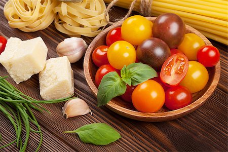 simsearch:400-06796273,k - Italian food cooking ingredients. Pasta, tomatoes, basil. Top view with copy space Stock Photo - Budget Royalty-Free & Subscription, Code: 400-08111976