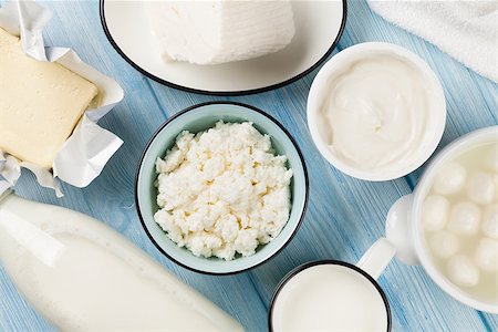 Dairy products on wooden table. Sour cream, milk, cheese, egg, yogurt and butter. Top view Stock Photo - Budget Royalty-Free & Subscription, Code: 400-08112033