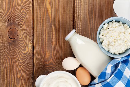 Dairy products on wooden table. Sour cream, milk, cheese, egg, yogurt and butter. Top view with copy space Stock Photo - Budget Royalty-Free & Subscription, Code: 400-08112041