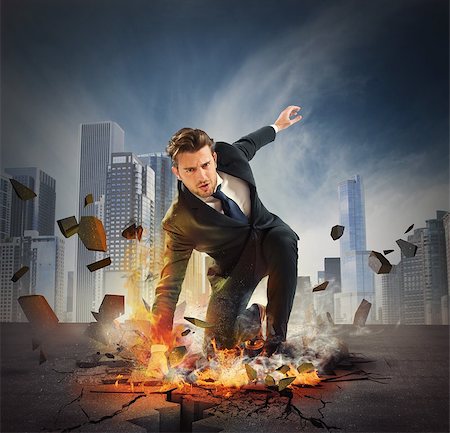 super - Businessman determined breaks the asphalt with force Stock Photo - Budget Royalty-Free & Subscription, Code: 400-08112128