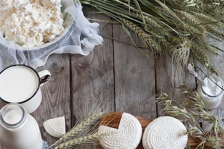 Tzfat cheese, milk, cottage cheese, wheat and oat grains on old wooden background. Concept of judaic holiday Shavuot. Stock Photo - Budget Royalty-Free & Subscription, Code: 400-08112744