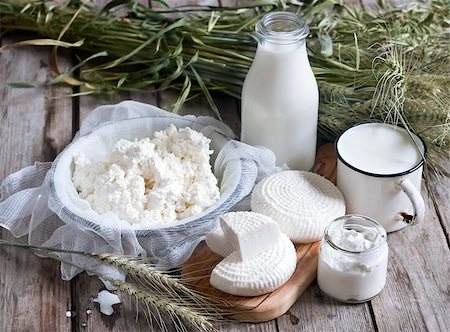Tzfat cheese, milk, cottage cheese, wheat and oat grains on old wooden background. Concept of judaic holiday Shavuot. Stock Photo - Budget Royalty-Free & Subscription, Code: 400-08112742