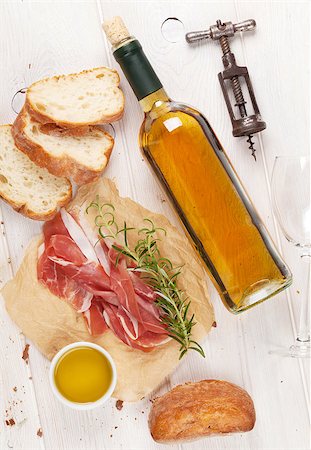 simsearch:400-06207145,k - Prosciutto, wine, ciabatta, parmesan and olive oil on wooden table. Top view Stock Photo - Budget Royalty-Free & Subscription, Code: 400-08112916