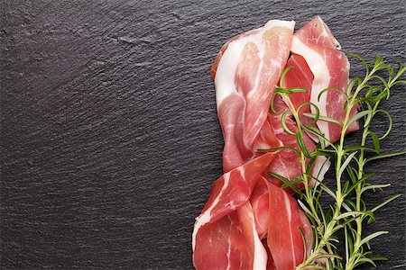 simsearch:400-06207145,k - Prosciutto with rosemary on black stone table Stock Photo - Budget Royalty-Free & Subscription, Code: 400-08112913