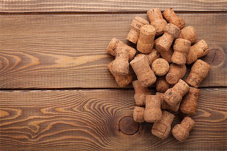 stopper - Heap of champagne corks over rustic wooden table background with copy space Stock Photo - Budget Royalty-Free & Subscription, Code: 400-08112936