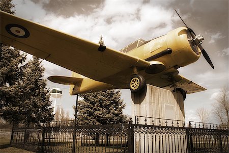 simsearch:400-04996557,k - A vintage edit of an old historic war plane on display in a public park, located in Smiths Falls, Canada. Stock Photo - Budget Royalty-Free & Subscription, Code: 400-08113485