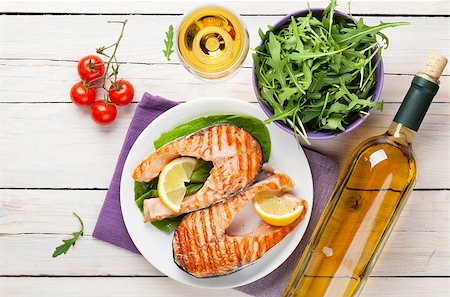 Grilled salmon and white wine on wooden table. Top view Stock Photo - Budget Royalty-Free & Subscription, Code: 400-08113644