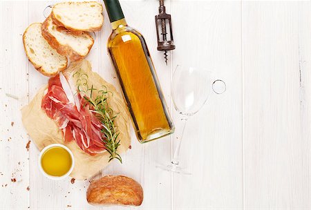 simsearch:400-06207145,k - Prosciutto, wine, ciabatta, parmesan and olive oil on wooden table. Top view with copy space Stock Photo - Budget Royalty-Free & Subscription, Code: 400-08113695