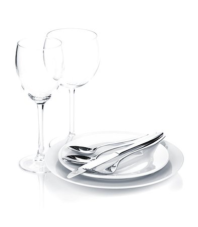 simsearch:400-06076985,k - Silverware or flatware set over plates and wine glasses. Isolated on white background Stock Photo - Budget Royalty-Free & Subscription, Code: 400-08113730