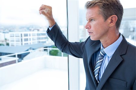 simsearch:400-04283915,k - Businessman looking out the window in his office Stock Photo - Budget Royalty-Free & Subscription, Code: 400-08136270