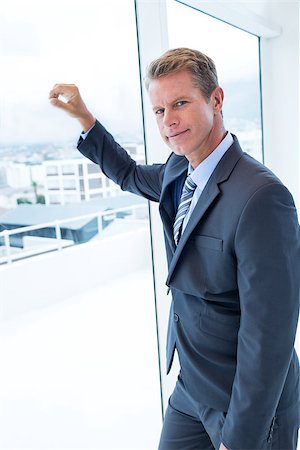 simsearch:400-04283915,k - Businessman looking out the window in his office Stock Photo - Budget Royalty-Free & Subscription, Code: 400-08136271