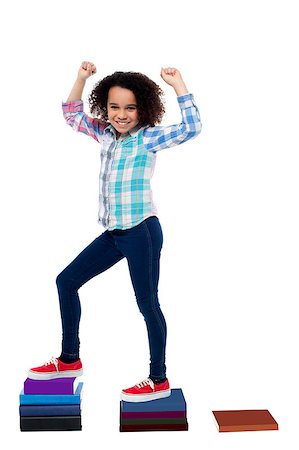 Pretty girl child moving up in school grades Stock Photo - Budget Royalty-Free & Subscription, Code: 400-08130858