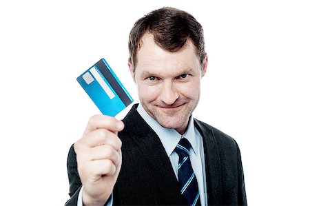 simsearch:400-06858518,k - Handsome businessman showing his credit card Stock Photo - Budget Royalty-Free & Subscription, Code: 400-08130881